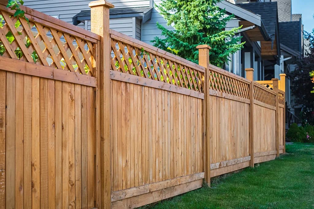 A new cedar fence with a lattice top