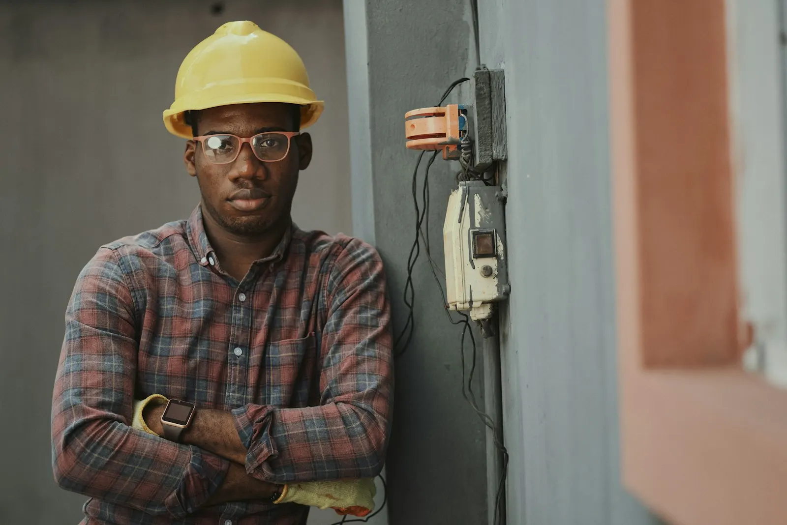 A contractor in a hard hat on a job site